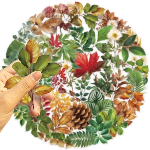 Macro view of transparent PET botanical stickers showing realistic leaf textures for DIY decor