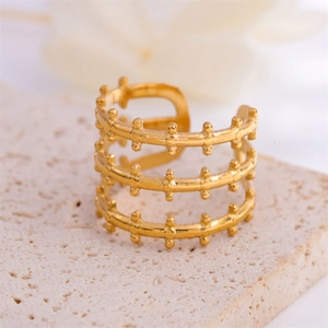 Three-layer open ring in 18k gold plated titanium steel with small dot accents