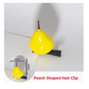 Detail view of yellow pear hair clip with size dimensions 3cm width and 5cm height