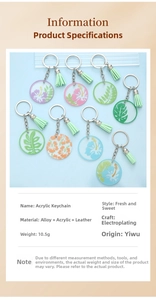 Detailed view of acrylic flower keychains with tropical leaves and green leather tassels