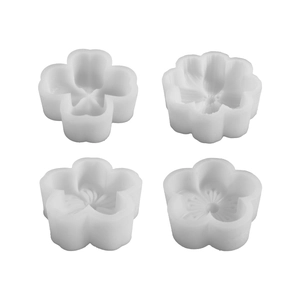 Set of four floral silicone molds for aromatherapy candles and DIY crafts on white background