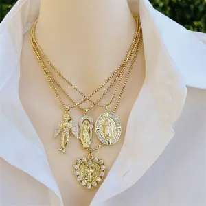 Layered 18K gold plated necklaces featuring zircon Virgin Mary and angel pendants