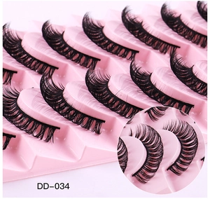 Close-up detail of DD-034 curly Russian faux mink eyelashes in 10-pair pack
