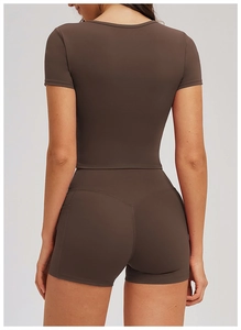 Rear view of mocha yoga set showing tight fit crop top and high waist shorts