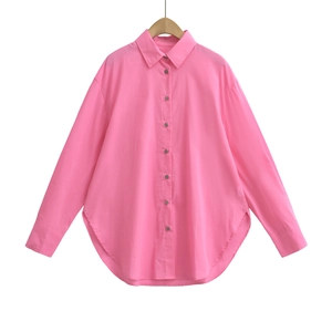 Pink long sleeve button-down shirt with turn-down collar on a wooden hanger