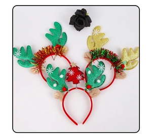 Close-up of Christmas antler headbands with sequins, tinsel, and festive snowflakes