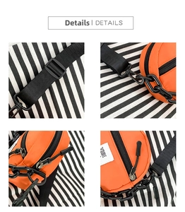 Détails d'un sac bandoulière en nylon orange avec chaîne noire et sangle réglable