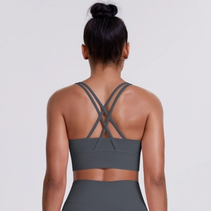 Close-up of high-elasticity dark grey sports bra featuring cross-back strap design
