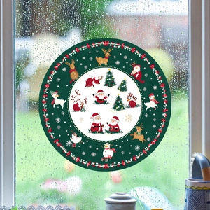 Christmas window stickers with Santa and reindeer on glass with raindrop texture