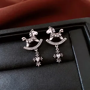 Vintage silver horse drop earrings with shimmering zircon and gothic cross pendant