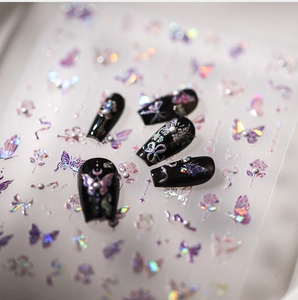 Detailed macro view of 5D laser butterfly nail stickers with aurora polarising effect