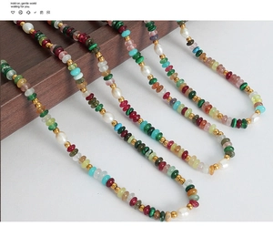 Detail view of Bohemian necklaces with freshwater pearls and natural gemstones