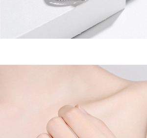 Macro detail of silver zircon flower ring showing still life and model wearing style