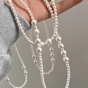 Long multilayered pearl necklace featuring geometric French vintage design for women