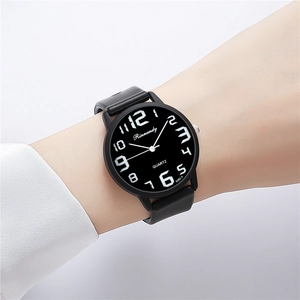 Close-up of Rinnandy quartz watch with black silicone strap and large white numerals