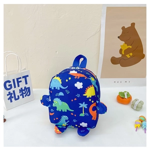 Detailed close-up of blue children's dinosaur backpack with side wing accents and cute print