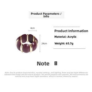 Detailed view of dark red acrylic bangle with gold accents showing 4cm inner diameter