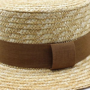 Classic woven boater hat in natural straw with vintage dark brown decorative ribbon