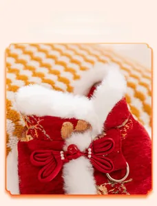 Detail of red pet vest featuring traditional Chinese knot buttons and white faux fur collar