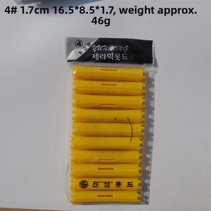 Macro detail of yellow size 4 plastic hair rollers in transparent sealed bag