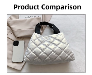 Detail of white quilted tote bag with black strap handles and diamond pattern texture