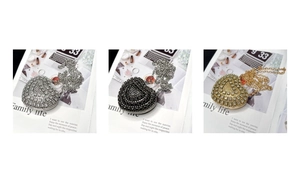 Detailed comparison of heart-shaped rhinestone mini bags in silver, black and gold finishes