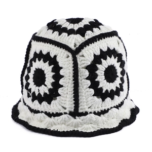 Handmade crochet bucket hat with vintage black and white floral pattern and hollow knit texture