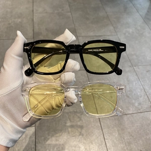 Retro square oversized sunglasses with black and transparent frames and yellow lenses