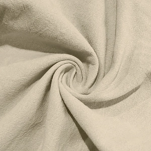 Vue macro détaillée de la texture du tissu en lin beige respirant et du tissage doux