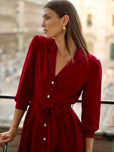 Elegant dark red retro short dress with V-neck, golden buttons and bow-tie waist belt