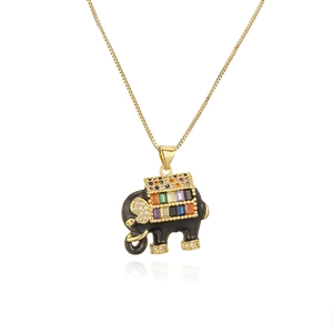 Macro detail of elephant pendant with colorful rainbow zircons and gold box chain