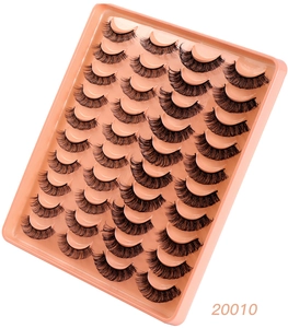 Close-up of 20 pairs of voluminous Russian curl eyelashes on a pink tray
