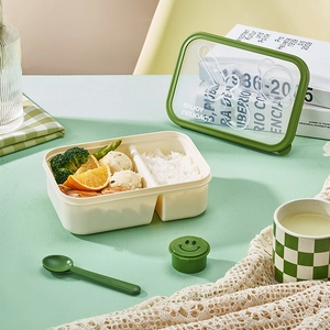 Beige dual-compartment lunch box with utensils and sauce container for office and students
