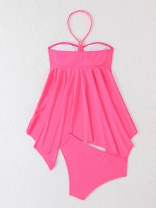 Detail of hot pink halter neck tankini with vertical ribbed texture and wavy hem