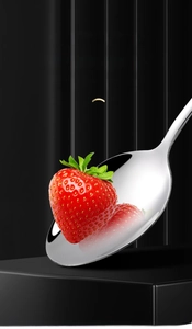 Macro detail of mirror-polished stainless steel spoon with clear strawberry reflection