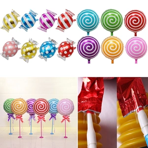 Detail view of colorful swirl lollipop foil balloons and self-sealing valve mechanism