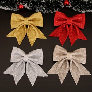 Glitter Christmas bow ornaments in gold, red and silver for holiday tree decoration