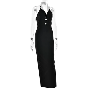 Side view of sleek black halter maxi dress featuring white collar and button accents