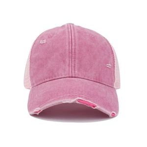 Detail of pink washed cotton trucker hat with distressed rips and breathable mesh