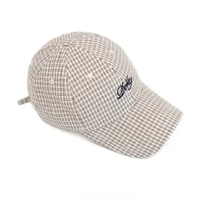 Top view of plaid baseball cap showing black letter embroidery and checkered pattern