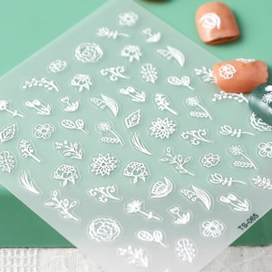 Detail of 5D white floral embossed nail stickers on transparent sheet with model TS-065