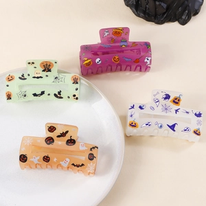 Set of four Halloween themed square hair claws with pumpkin ghost and bat prints
