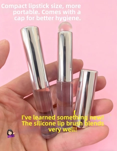 Detail view of portable silicone lip brush with metallic cap and compact lipstick style