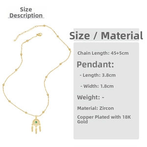 Macro detail of dreamcatcher necklace with dimensions 3.8x1.8cm in 18K gold plated copper