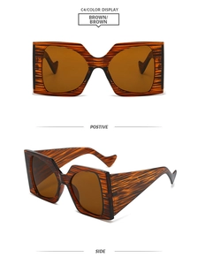 Detailsicht der quadratischen Oversize-Sonnenbrille mit brauner Holzmaserung
