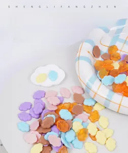Detailed view of 2cm miniature cloud-shaped candy resin charms in various pastel colors