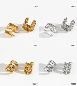 Detail showing various geometric striped ear cuffs in gold and silver stainless steel