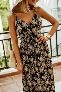Detail of V-neck sleeveless floral maxi dress in black with vintage summer patterns