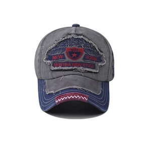 Close-up of vintage washed cotton New York embroidery patch on a distressed baseball cap