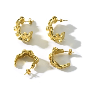 Irregular textured gold stainless steel hoop earrings with minimalist lava finish